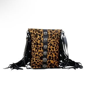Myra Bag Leopard with silver conchos and fringe.